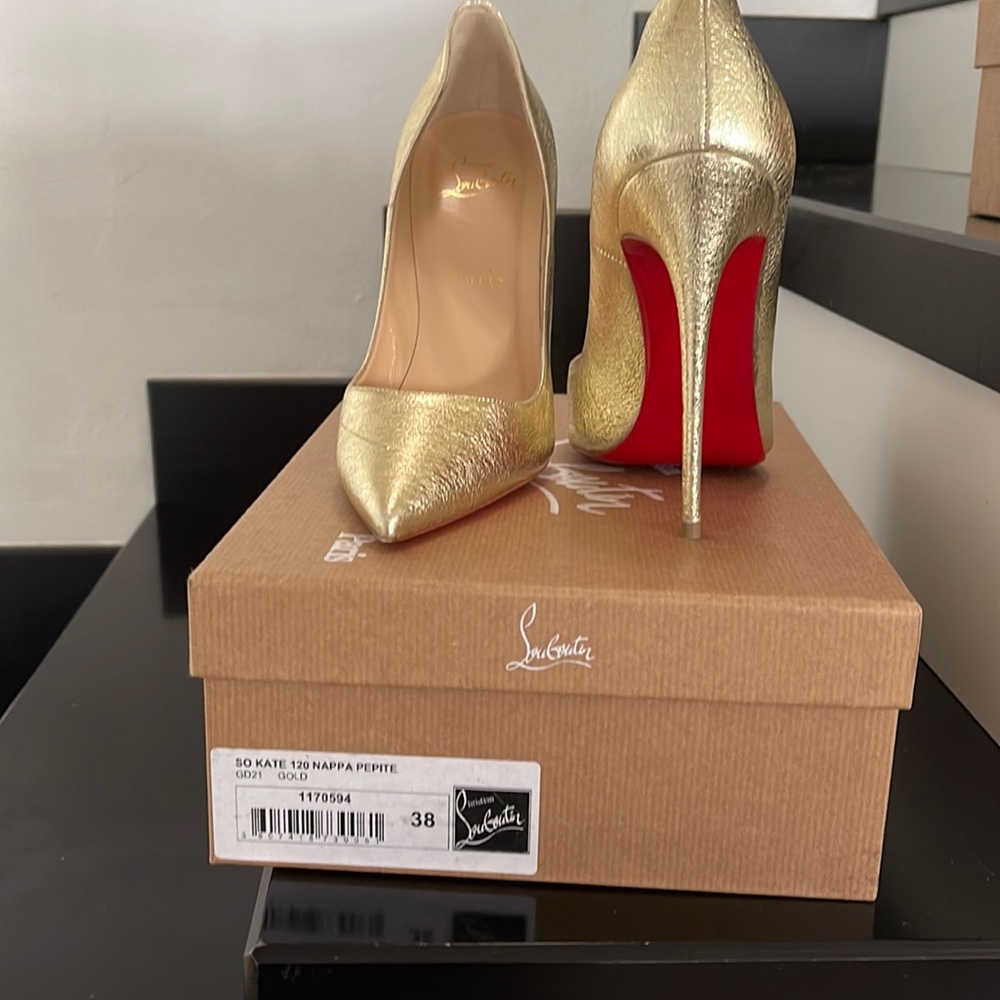 Louboutin “So Kate” Gold size 38.  Only worn once.
